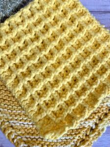 trio of yellow dish cloths