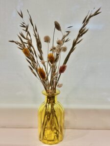 dried flowers in decorative jars