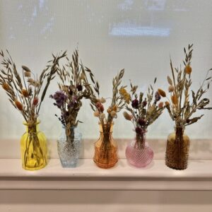 dried flowers in decorative jars