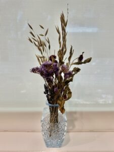 dried flowers in decorative jars