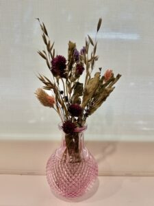 dried flowers in decorative jars